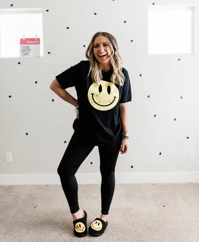 Dani, founder of The Bestie Squad, in a smiley tee